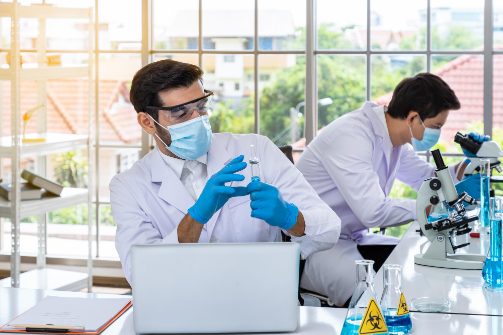 Researchers analysing samples at laboratory workstations